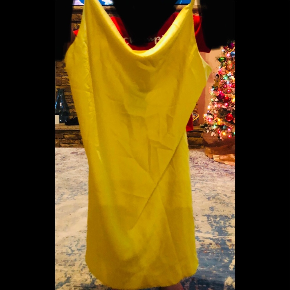 Large women’s yellow silky dress from fashion nova can be used as a long shirt
